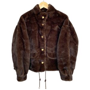 Veste en fausse fourrure au toucher très doux avec poches décoratives