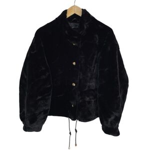 Veste en fausse fourrure au toucher très doux avec poches décoratives