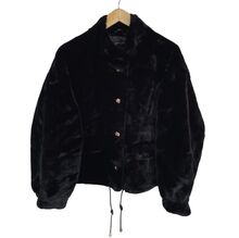 Veste en fausse fourrure au toucher très doux avec poches décoratives