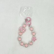 Dragonne de téléphone en perles irisées effet cristal avec nœud et étoile