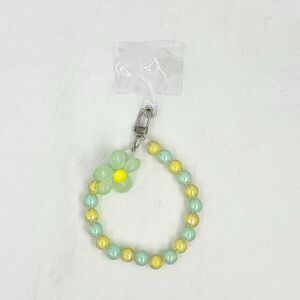 Dragonne de téléphone en perles de teinte pastel avec fleur de marguerite