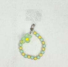 Dragonne de téléphone en perles de teinte pastel avec fleur de marguerite