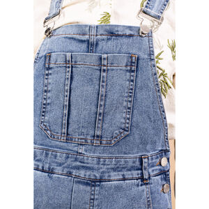 Salopette coupe droite en denim bleu avec un léger délavage