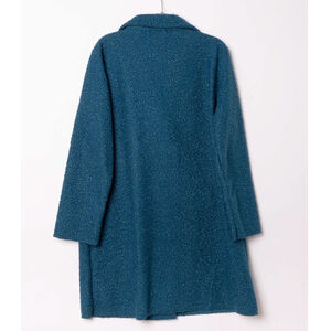 Manteau mi-long en bouclé doux à double boutonnage avec poches