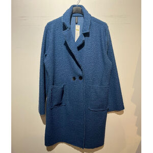 Manteau mi-long en bouclé doux à double boutonnage avec poches