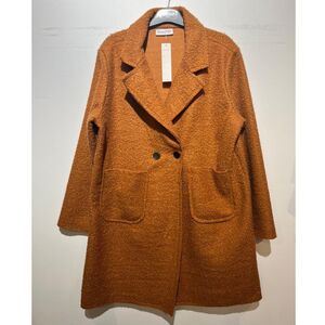 Manteau mi-long en bouclé doux à double boutonnage avec poches