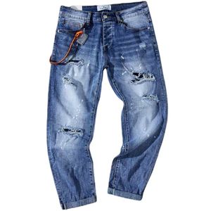 Jeans avec imprimé tâche de peintures et des abrasions
