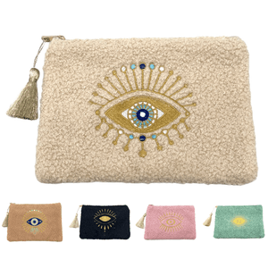 Petite trousse moutonnée avec un motif central brodé d'un œil