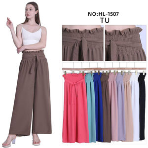 Pantalon ample à taille haute smockée avec une ceinture à nouer