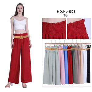 Pantalon ample à taille haute smockée avec une ceinture à boucle