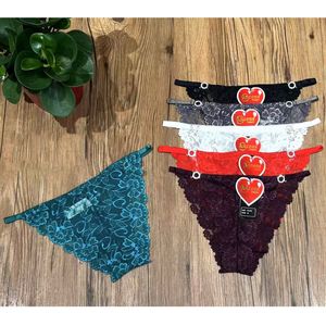 Tanga uni tout en dentelle à motif floral de la marque "Ancona"