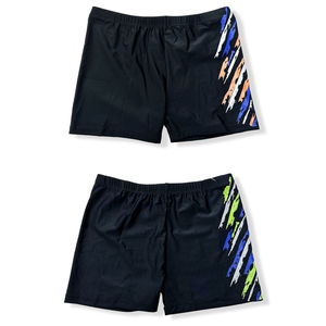 Short de bain court uni à motif graphique abstrait sur le côté droit