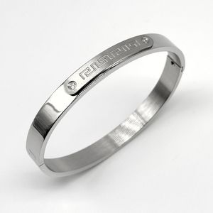 Bracelet en acier inoxydable argenté avec motif grec et zircons