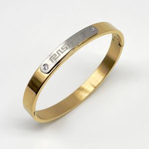 Bracelet en acier inoxydable doré avec motif grec et zircons