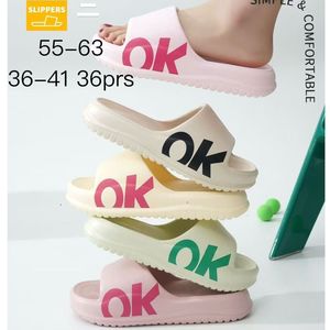 Mules pour femme coloris uni avec l'inscription OK