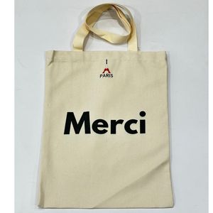 Tote bag en coton beige Merci Paris avec un motif Tour Eiffel