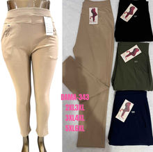 Pantalon slim grande taille avec poches à boutons décoratifs