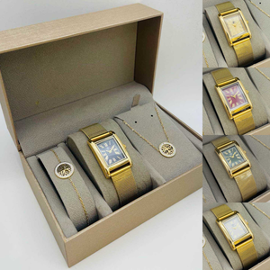 coffret taupe d'une montre à chiffres romains dorée + bijoux en acier