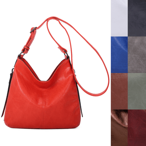 Besace en cuir synthétique avec des zips latéraux décoratifs