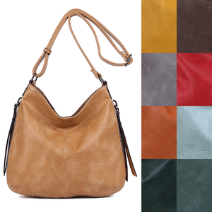 Besace en cuir synthétique avec des zips latéraux décoratifs