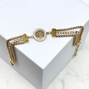 Bracelet doré à triple chaîne scintillante avec un disque ajouré  "Arbre de Vie"