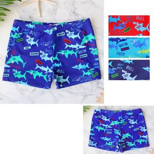 Boxer de bain enfant à motif de requins accompagné de mots-clés joyeux