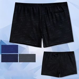 Short de bain à motif discret de mots Sport avec petite poche passepoilée