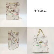 Sac en carton blanc marbré avec poignées torsadées Massiliano Sergio