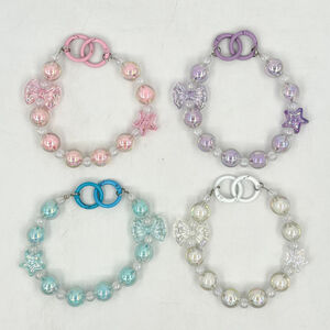 Dragonne de téléphone en perles irisées effet cristal avec nœud et étoile