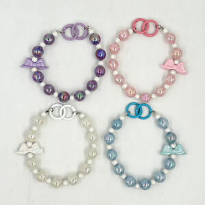 Dragonne de téléphone en perles de cristal irisées avec un gros nœud