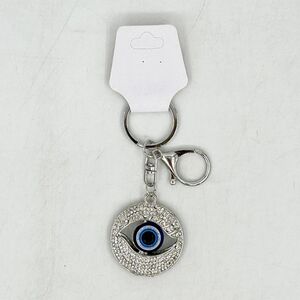 Porte-clés à motif Œil Grec entouré de cristaux transparents en métal argenté