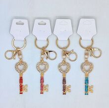 Porte-clés bijou recouvert de strass en clé à tête cœur Doré