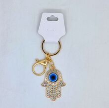 Porte-clés Main de Fatima avec un Oeil Bleu protecteur Doré