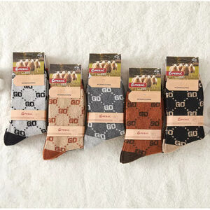 Chaussettes femme en laine ornées d'un motif monogramme GO