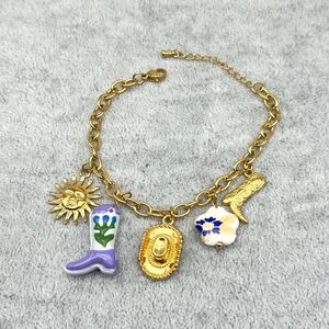 Bracelet breloques en acier inoxydable doré dans le thème western et bohème