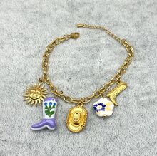 Bracelet breloques en acier inoxydable doré dans le thème western et bohème