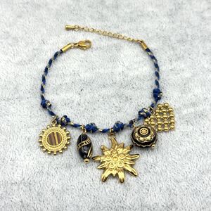 Bracelet en cordon bleu tressé et fils dorés à breloques acier inoxydable doré